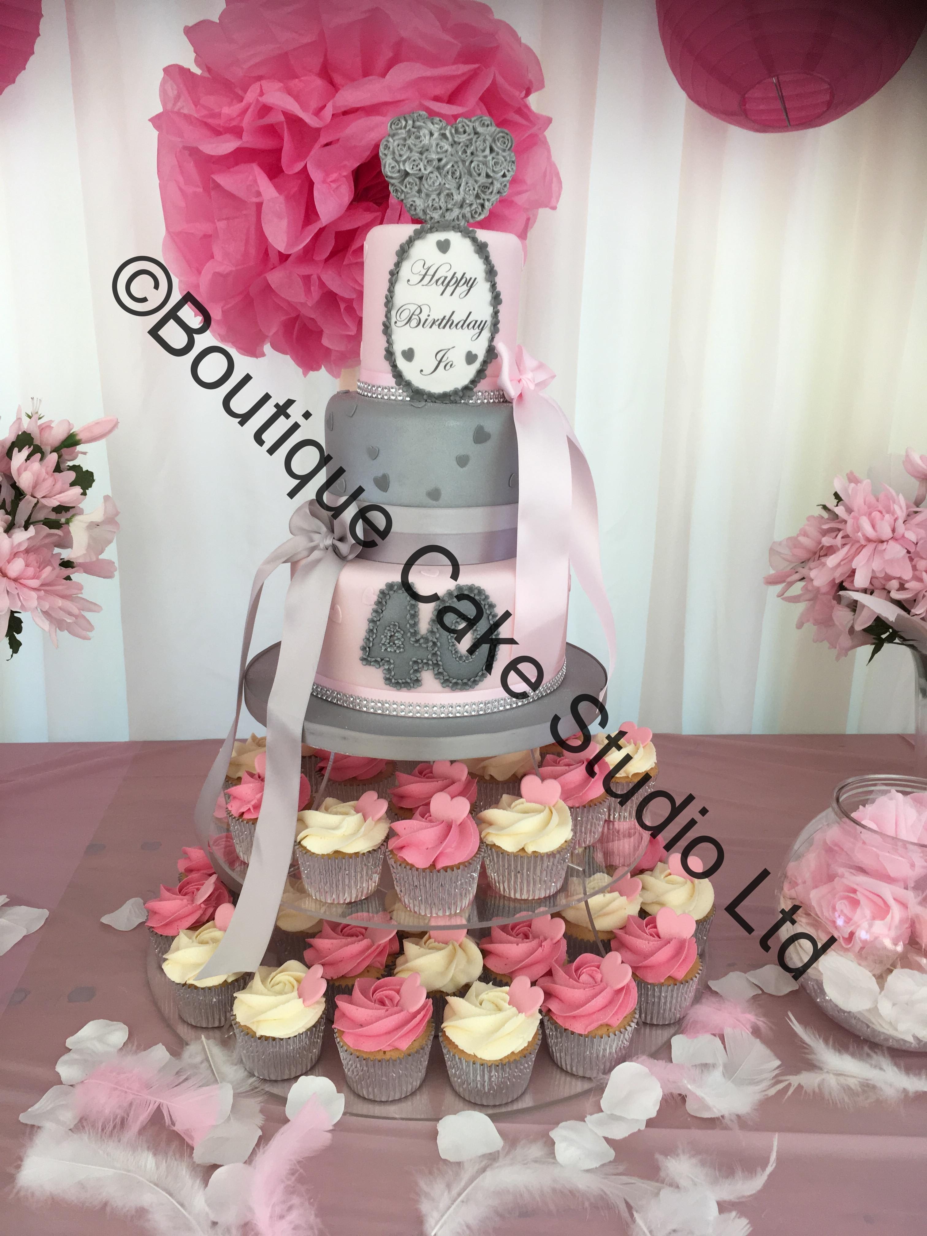 Stacked cake with cupcake tower