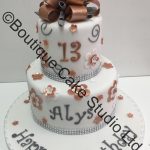 Stacked Cake with flowers, swirls and loop bow