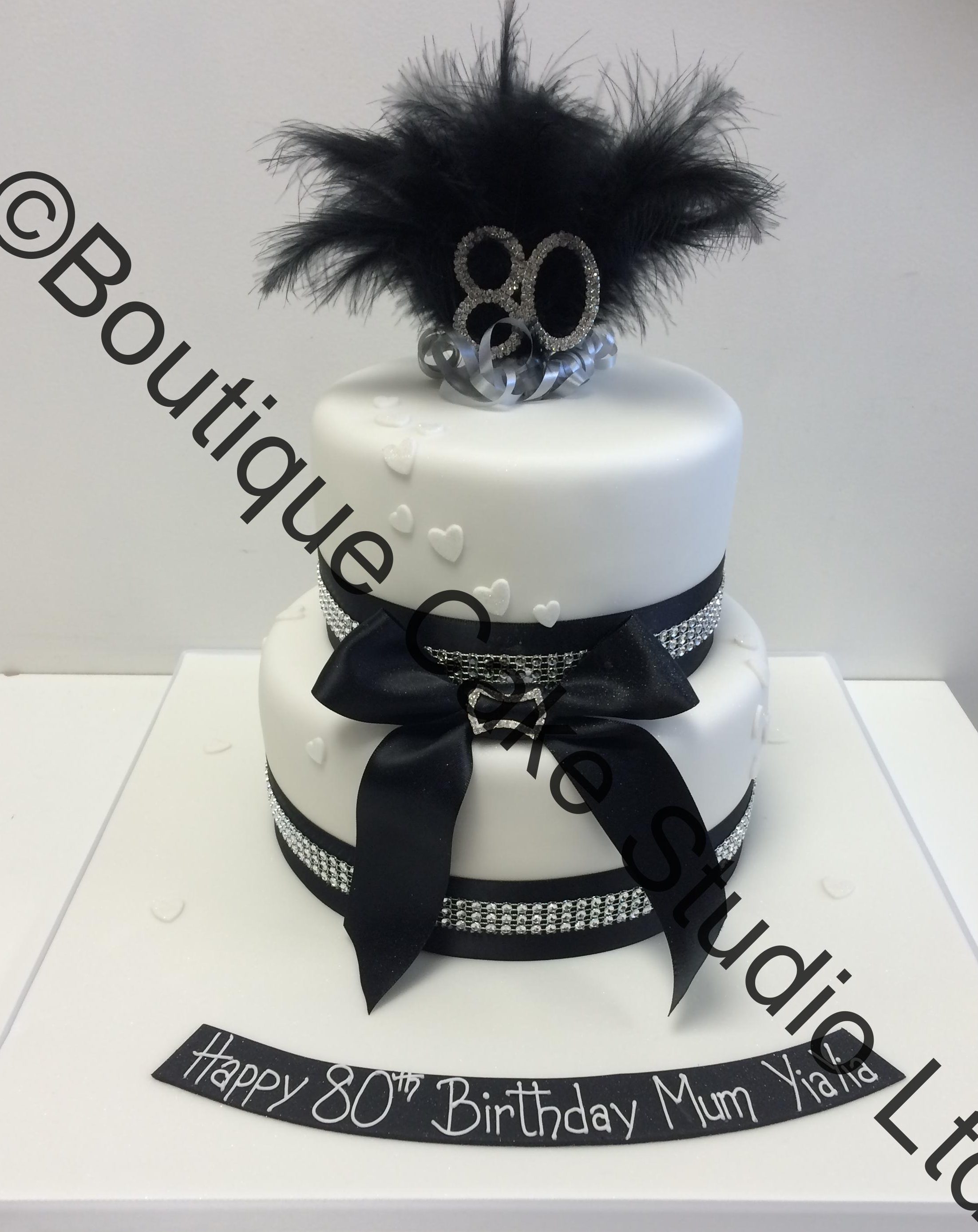 Black and White stacked cake with feathers