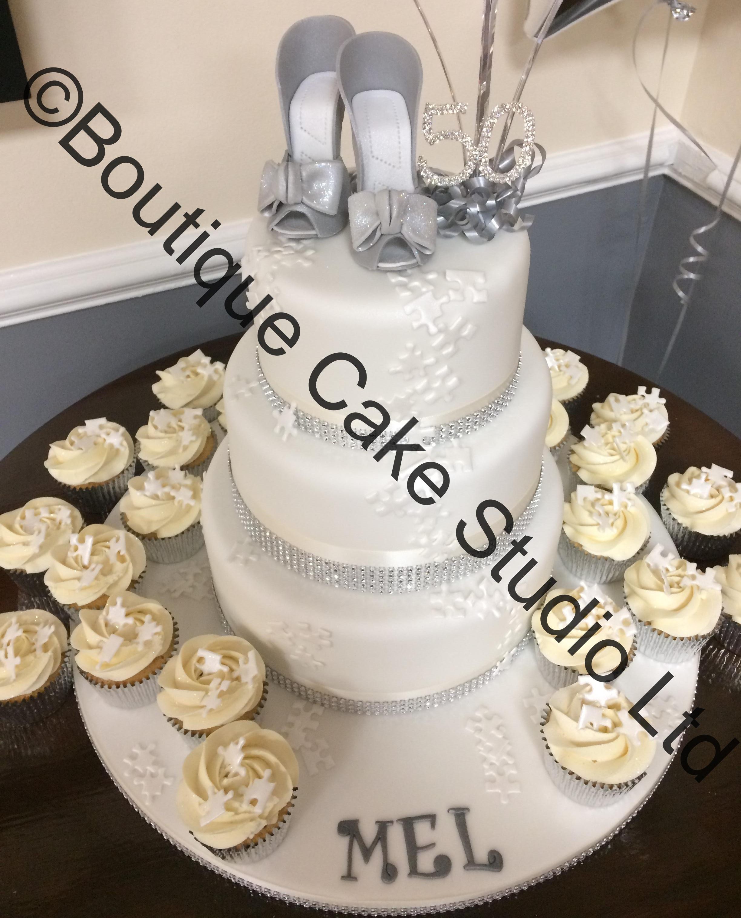 Stacked Cake with Silver Shoes and Puzzle Pieces