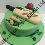 Cake with cricket bat and ball