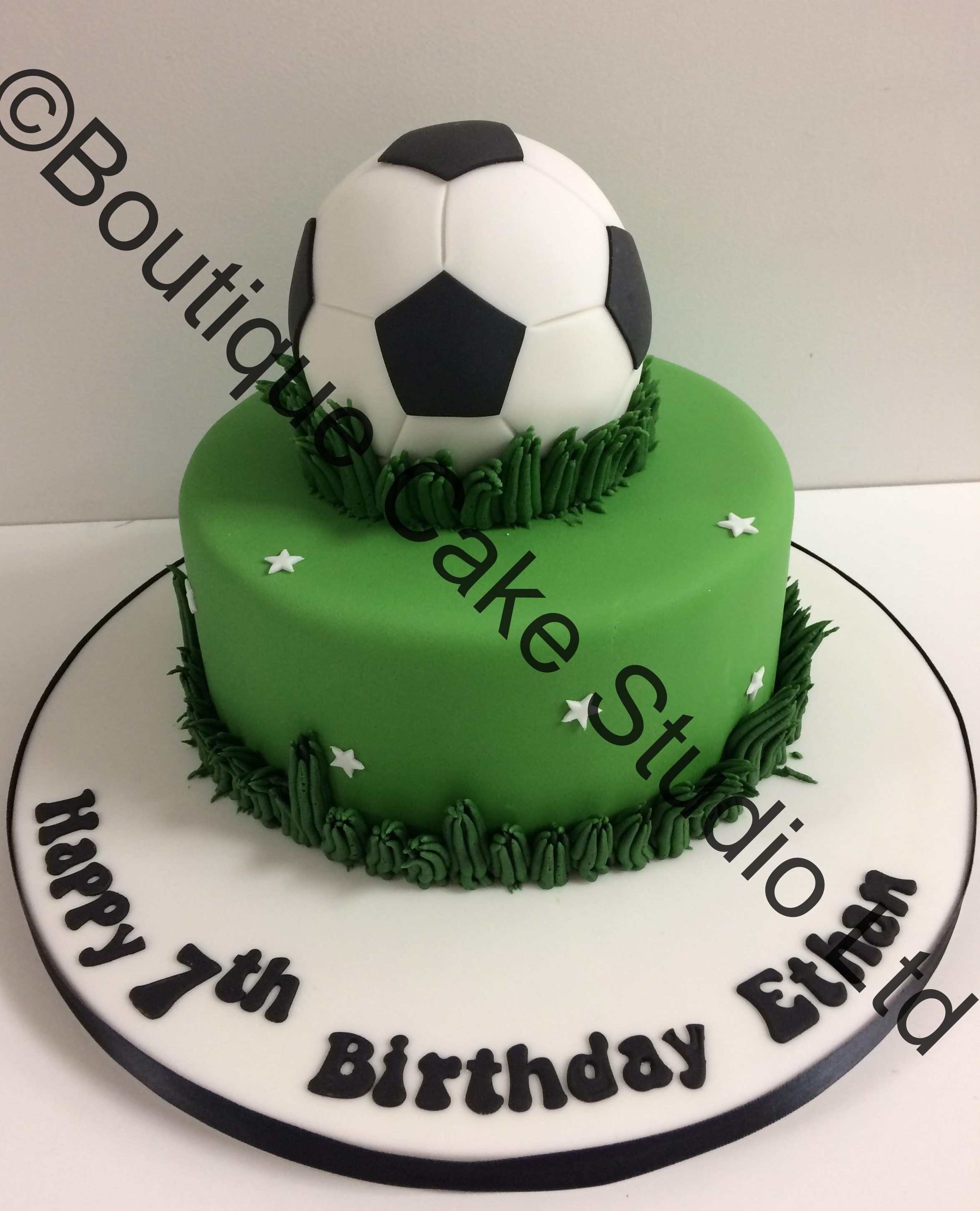 Small Football on a green base cake