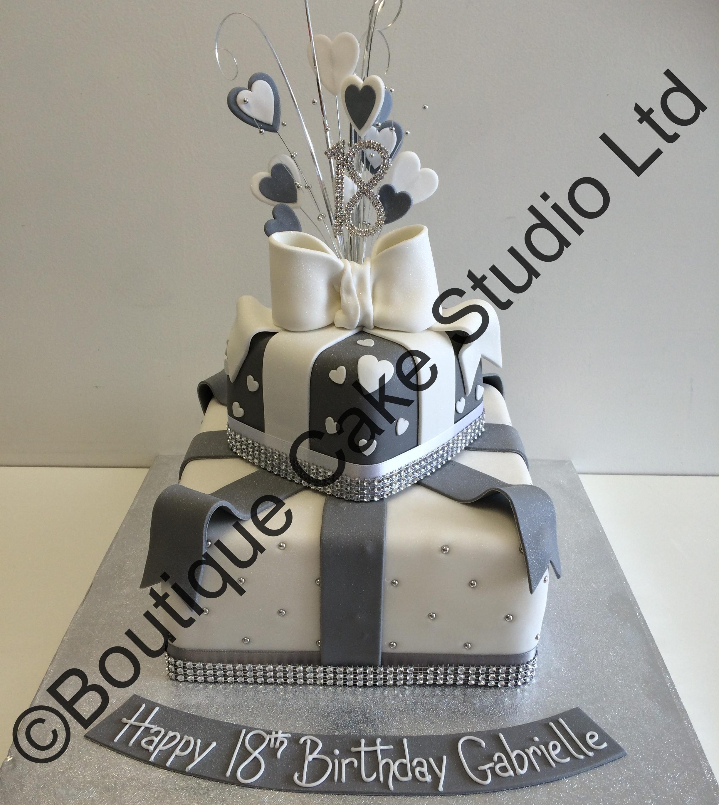Silver and white stacked parcel cake